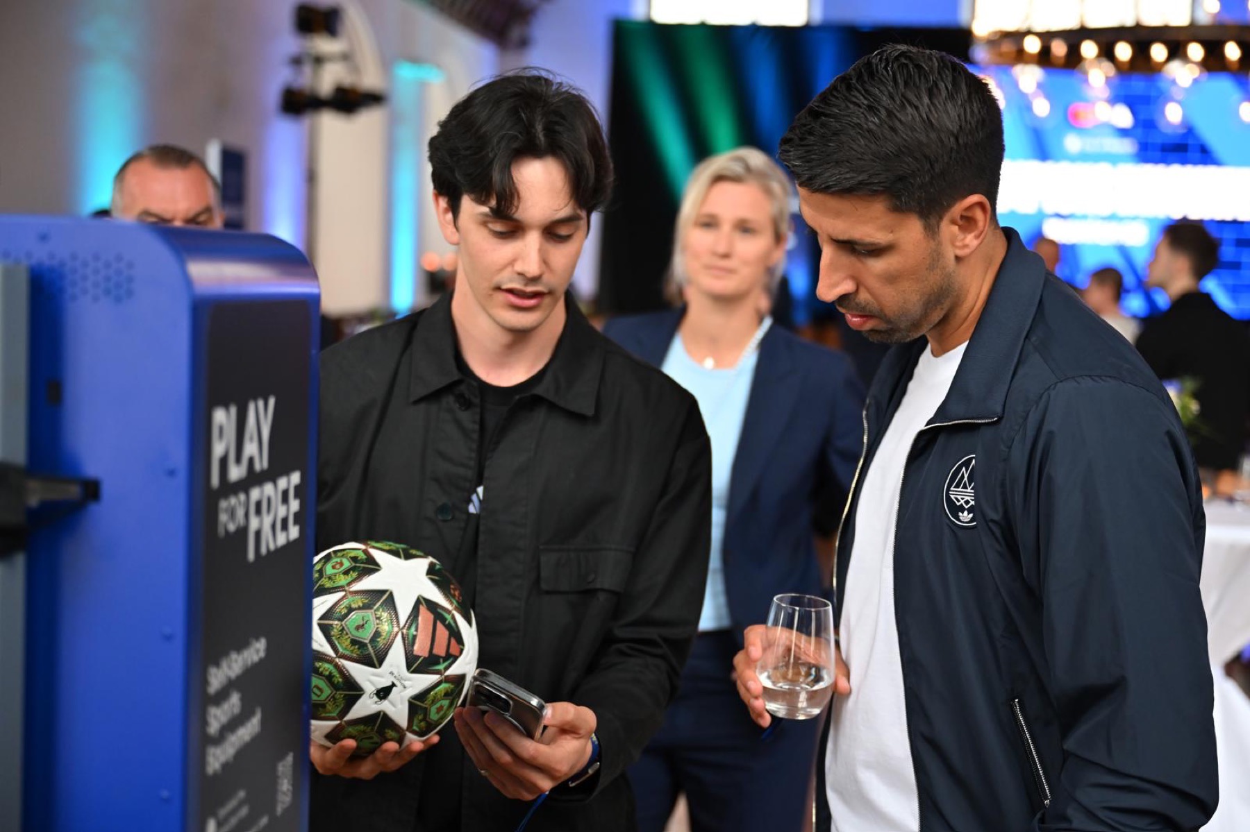 Guests at a station with the ball at the showcase, Sami Khedira among them.