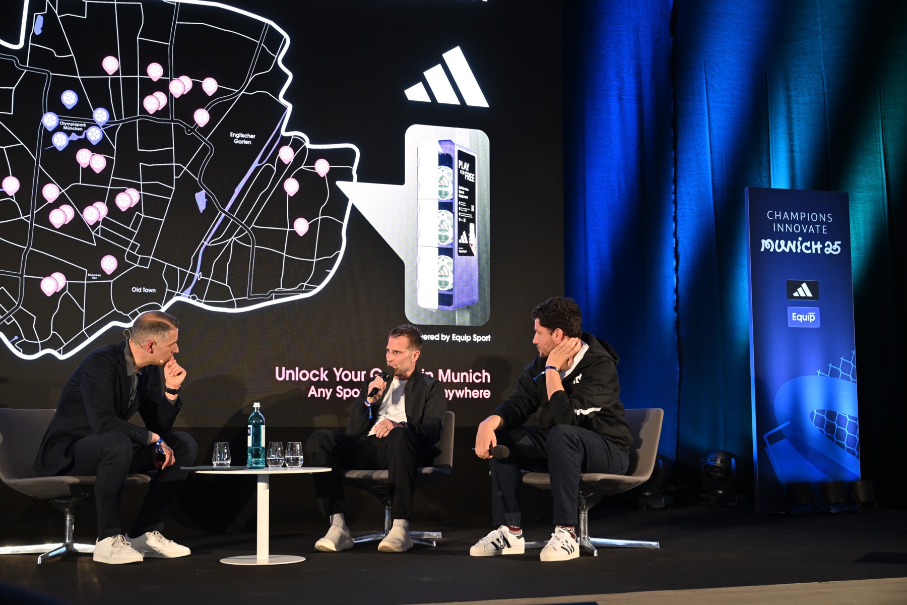 Panel on stage in front of the station map.